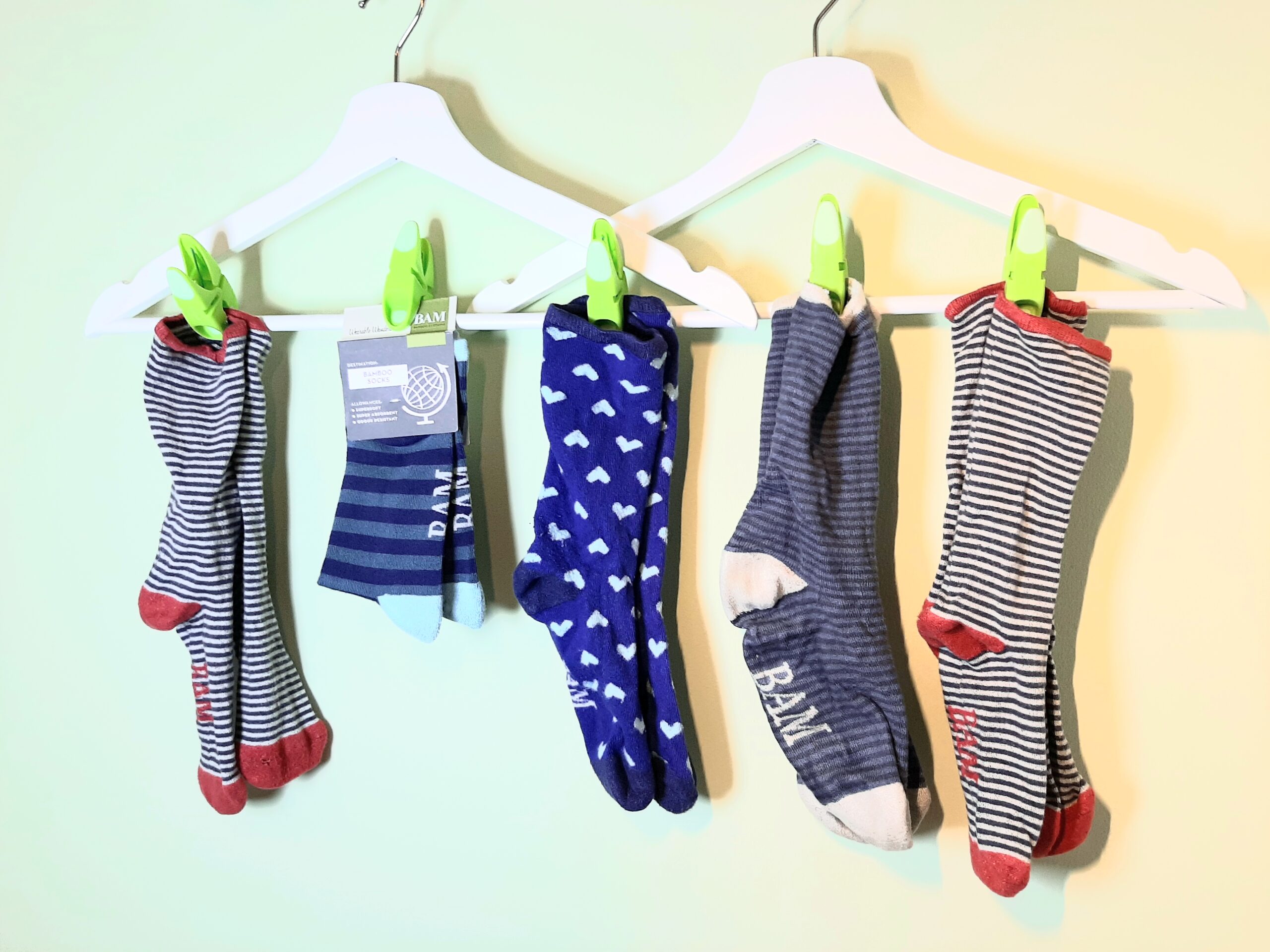 6 pairs of Bam socks pegged on coat hangers
