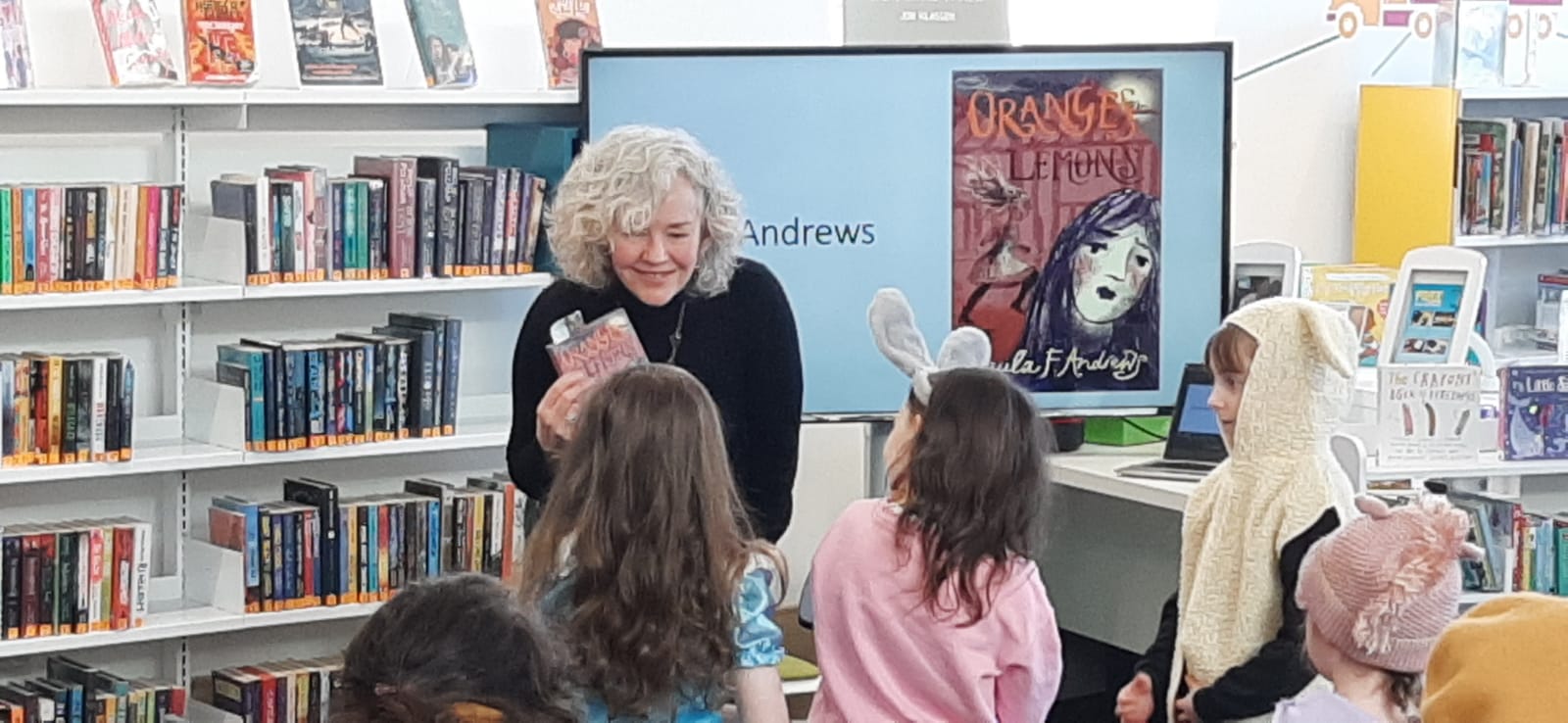 Paula leans into her young audience to talk about the cover of Oranges and Lemons